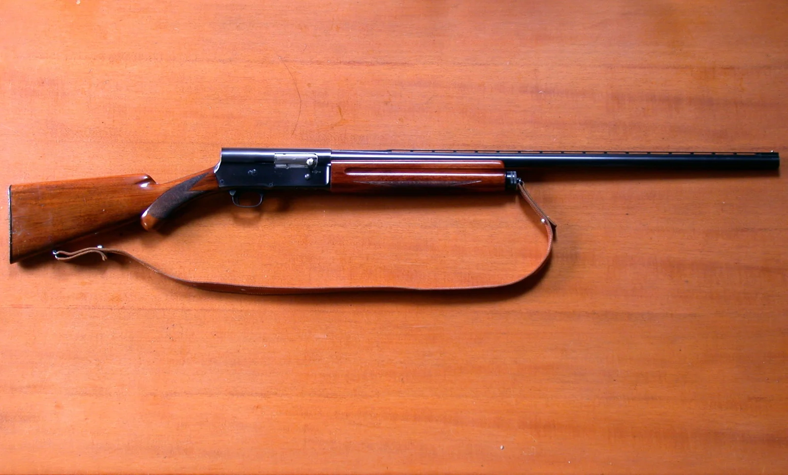 Full side view of an original-design Browning Auto-5 with its raised rear receiver profile.