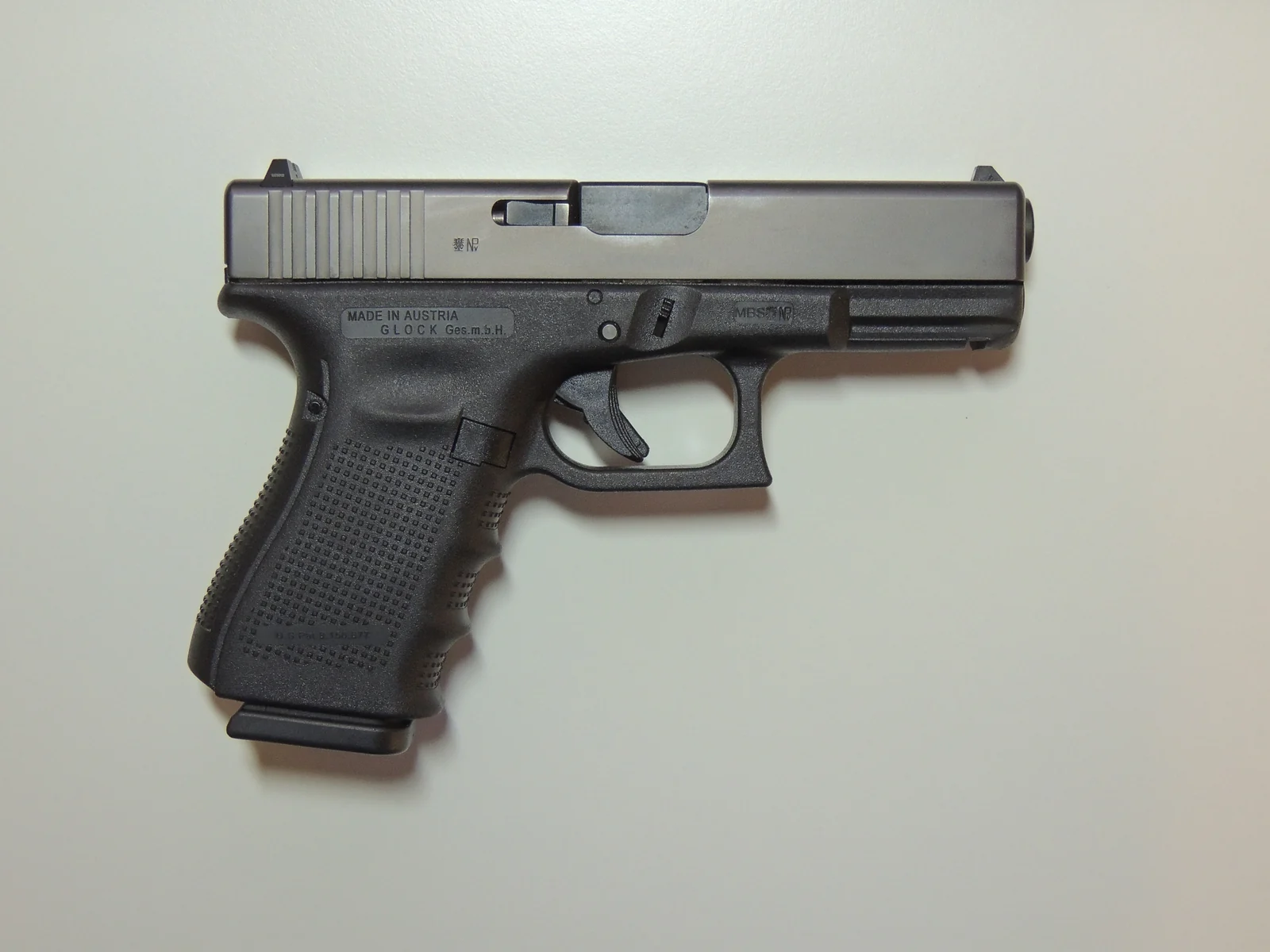 Right-side photograph of a Glock 19 Gen4 on a light background.